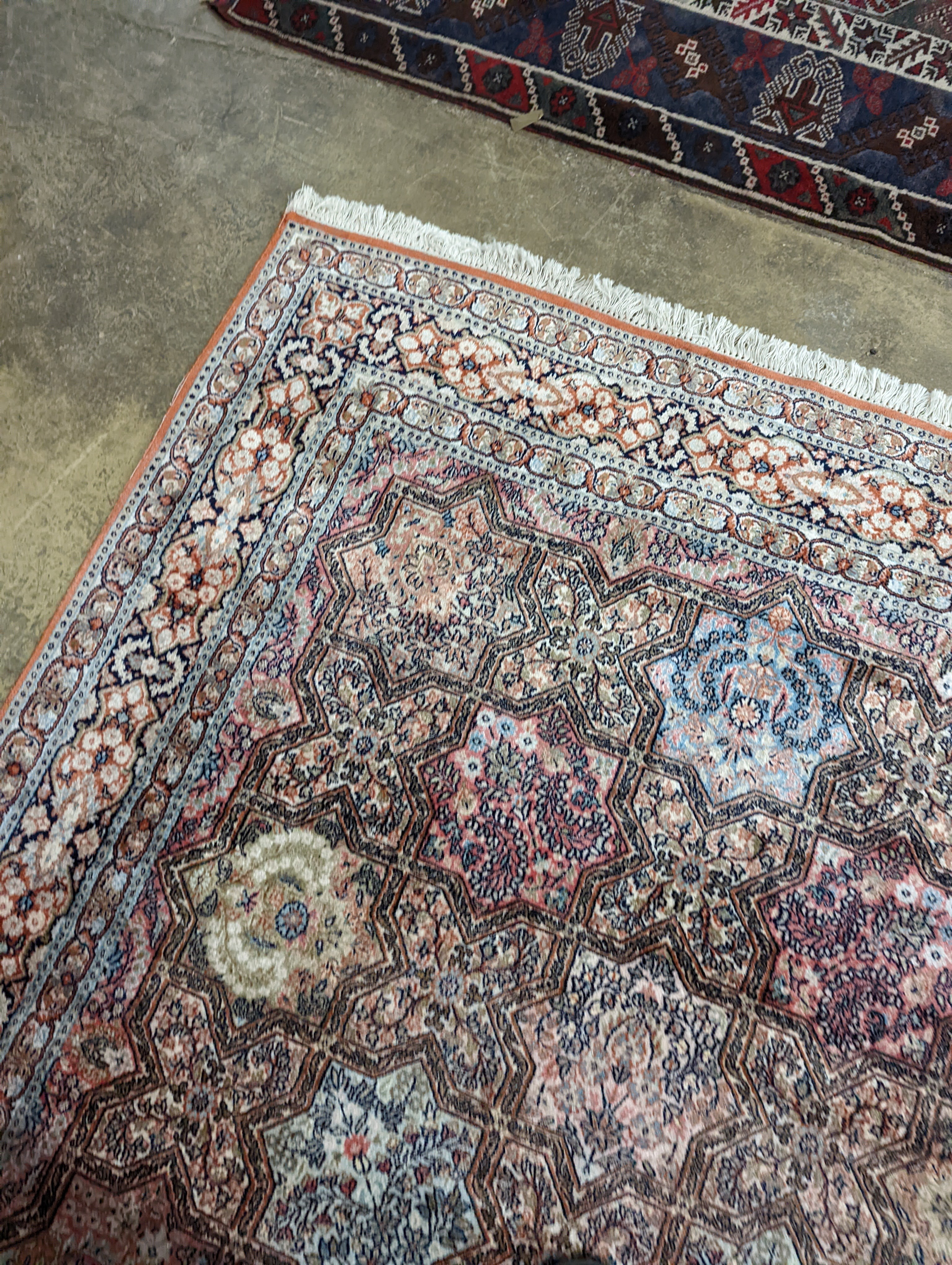 Two Turkish rugs and a Persian rugs. Largest, 284x172cm.
